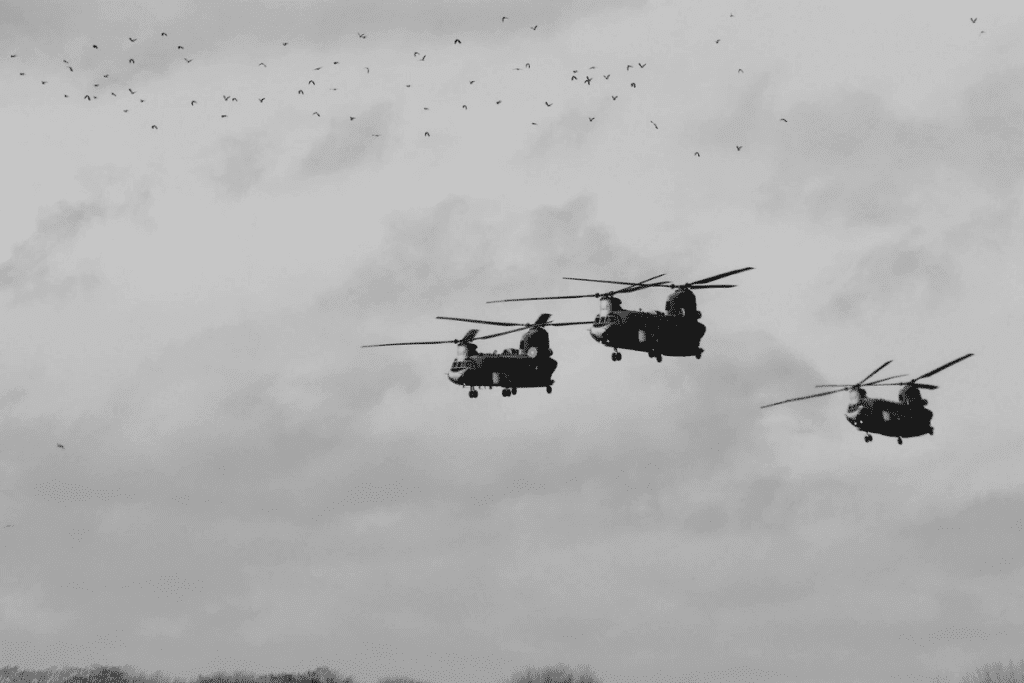 Three Chinook helicopters glide in perfect formation